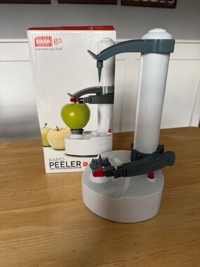 Ash Electric Apple Peeler in White and Gray with Red Accent